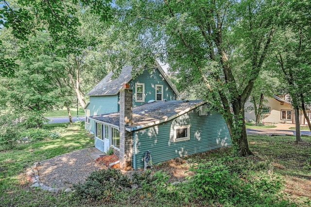 444 Vincent St, Saint Croix Falls, WI 54024 - view of property exterior with a shingled roof