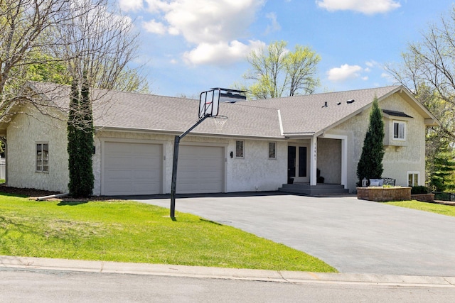 view of front of house featuring a garage, asphalt driveway, a front lawn, stucco siding, and roof with shingles