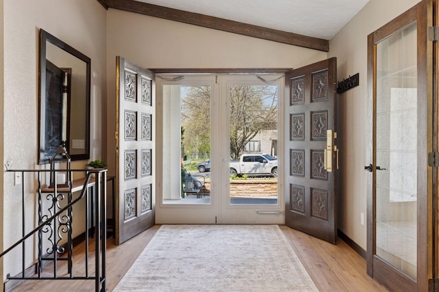 entryway with french doors and wood finished floors