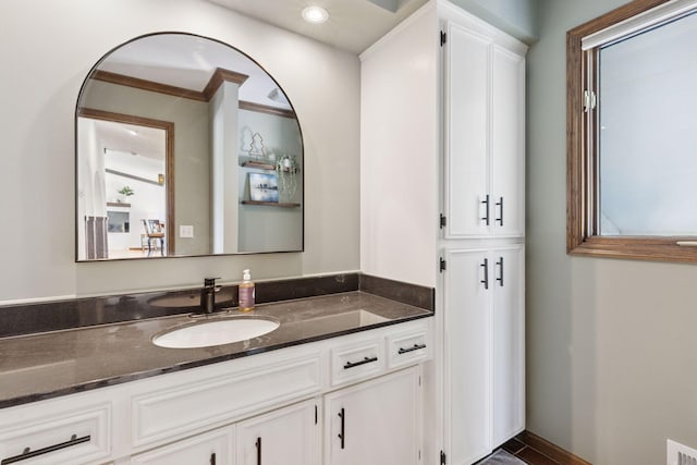 bathroom with vanity and baseboards