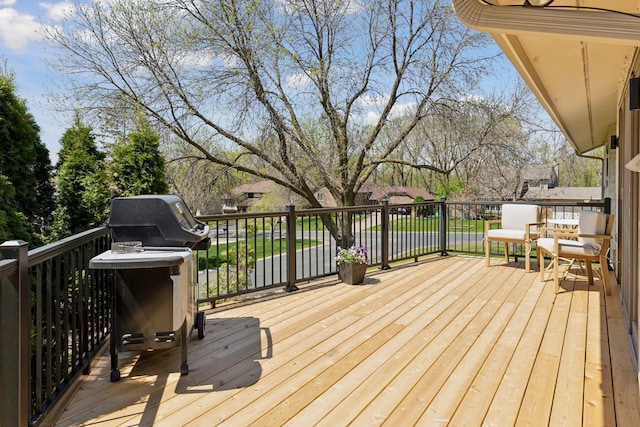 wooden terrace with area for grilling
