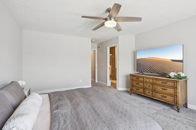 bedroom featuring baseboards, carpet, ceiling fan, and a textured ceiling