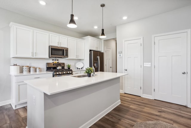 1836 Tyrone Dr, Shakopee, MN 55379 - kitchen featuring appliances with stainless steel finishes, dark wood finished floors, white cabinetry, and recessed lighting