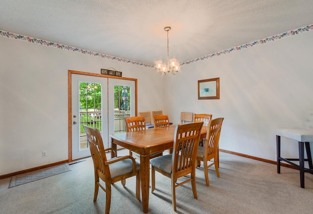 624 Main St, West Concord, MN 55985 - carpeted dining room with a chandelier, baseboards, and a textured ceiling