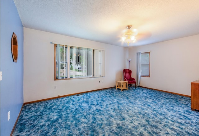 624 Main St, West Concord, MN 55985 - unfurnished room with a ceiling fan, carpet flooring, a textured ceiling, and baseboards