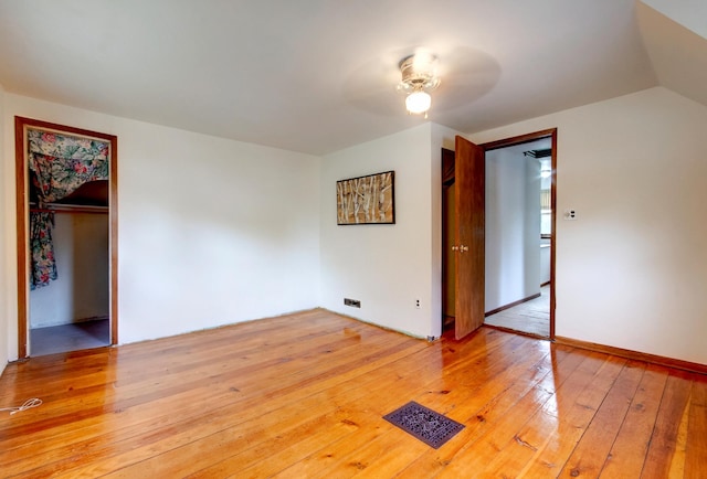 624 Main St, West Concord, MN 55985 - unfurnished bedroom with light wood-style floors, a closet, and ceiling fan