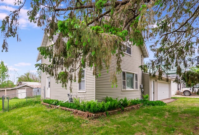 624 Main St, West Concord, MN 55985 - view of side of property featuring an attached garage