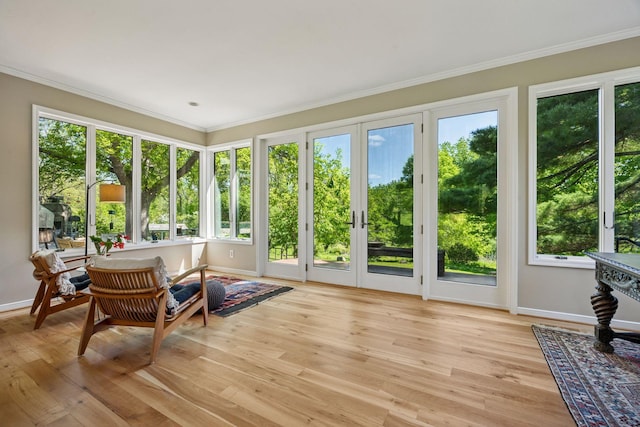 5510 Heather Dr SW, Rochester Twp, MN 55902 - sunroom / solarium featuring french doors, healthy amount of natural light, ornamental molding, and baseboards
