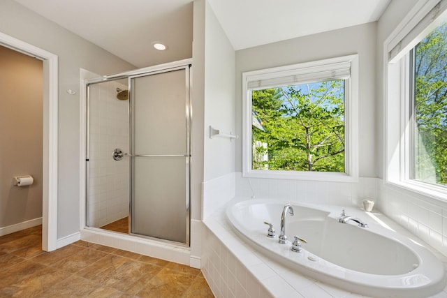 5510 Heather Dr SW, Rochester Twp, MN 55902 - bathroom featuring a stall shower and a garden tub
