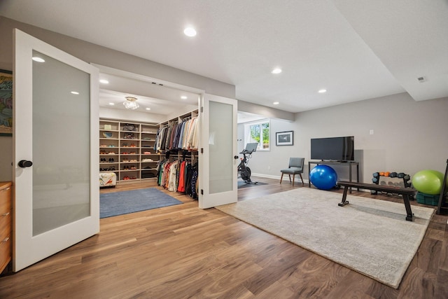 5510 Heather Dr SW, Rochester Twp, MN 55902 - workout area with recessed lighting, wood finished floors, and baseboards