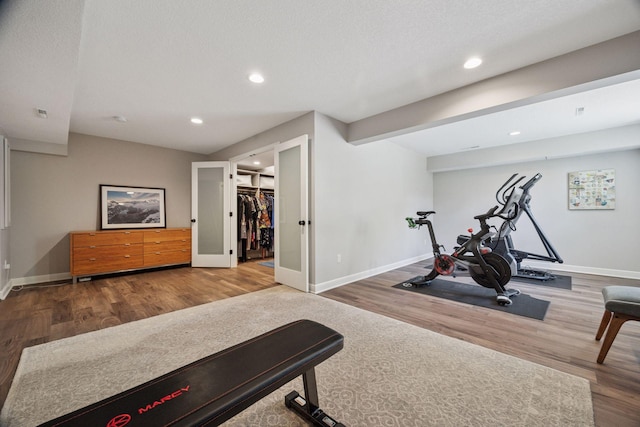 5510 Heather Dr SW, Rochester Twp, MN 55902 - exercise room featuring wood finished floors, baseboards, and recessed lighting