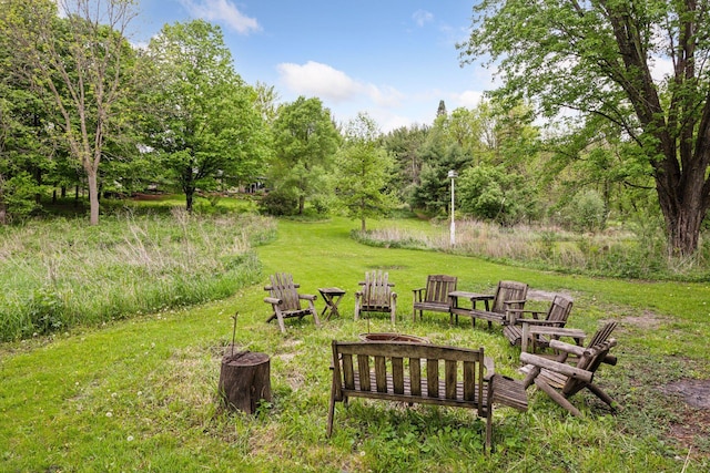 5510 Heather Dr SW, Rochester Twp, MN 55902 - view of green lawn featuring an outdoor fire pit