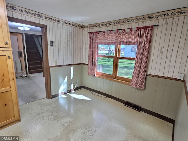 12115 Ramsey St, Becker, MN 55308 - empty room with stairs, baseboards, and concrete floors