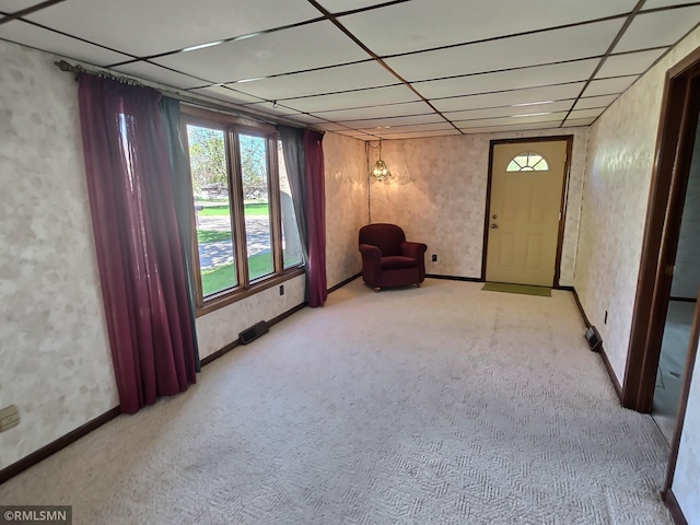 12115 Ramsey St, Becker, MN 55308 - unfurnished room featuring a drop ceiling, carpet floors, baseboards, and wallpapered walls