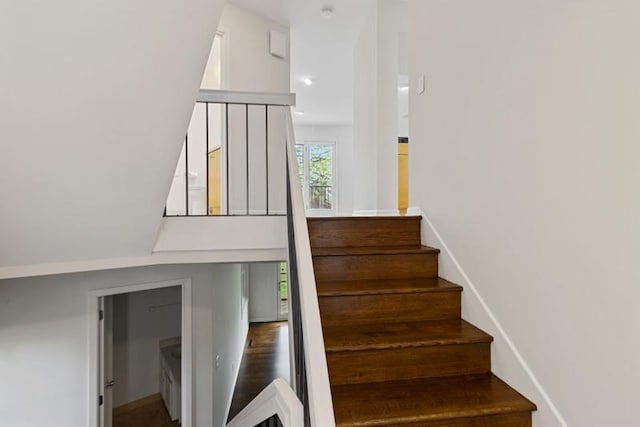 staircase featuring recessed lighting