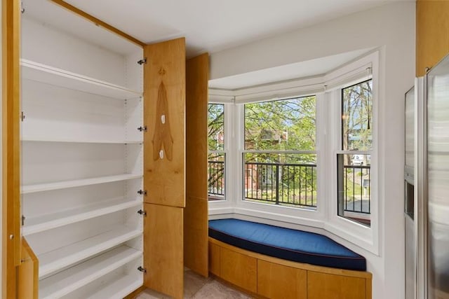 doorway featuring plenty of natural light and light tile patterned floors