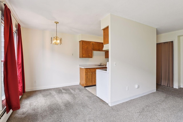 910 6th St S Unit 3, Hopkins, MN 55343 - kitchen featuring light carpet, brown cabinetry, a chandelier, light countertops, and baseboards