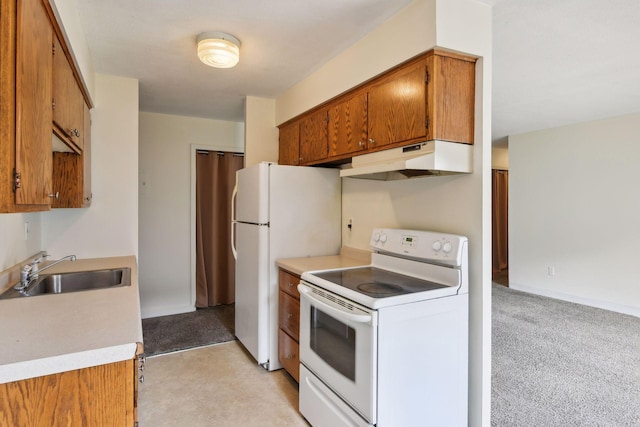910 6th St S Unit 3, Hopkins, MN 55343 - kitchen with white appliances, under cabinet range hood, a sink, brown cabinets, and light countertops