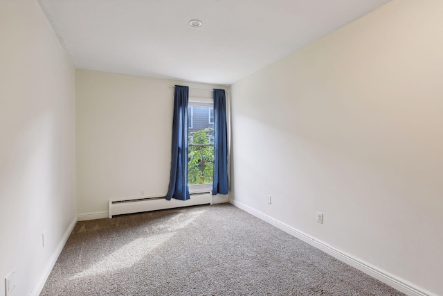910 6th St S Unit 3, Hopkins, MN 55343 - carpeted spare room featuring a baseboard heating unit and baseboards