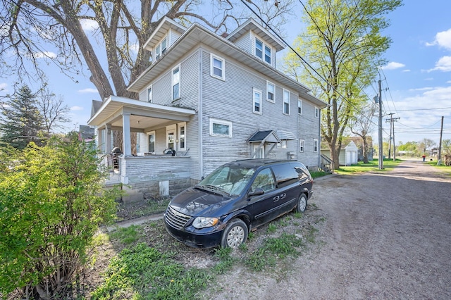 view of home's exterior featuring a porch