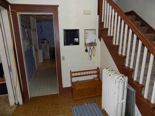 staircase with radiator