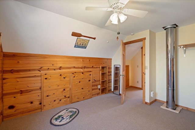 25185 Moreau Rd, Aitkin, MN 56431 - unfurnished bedroom with vaulted ceiling, carpet, baseboards, and a ceiling fan