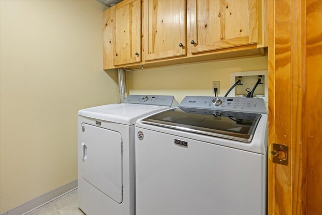 25185 Moreau Rd, Aitkin, MN 56431 - laundry area with cabinet space, washing machine and clothes dryer, and baseboards