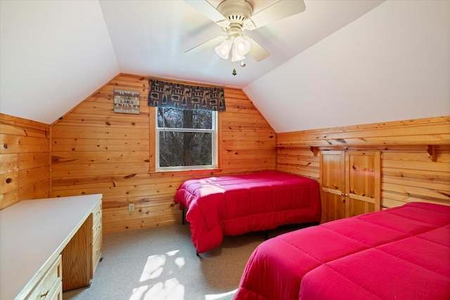 25185 Moreau Rd, Aitkin, MN 56431 - bedroom with vaulted ceiling, wood walls, carpet floors, and ceiling fan