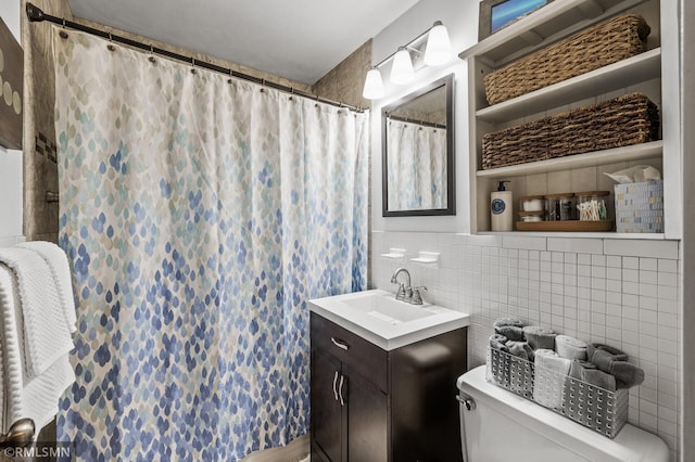 bathroom featuring tile walls, toilet, backsplash, vanity, and a shower with curtain