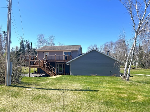 55715 State Highway 11, Warroad, MN 56763 - rear view of property featuring stairs, a wooden deck, and a lawn