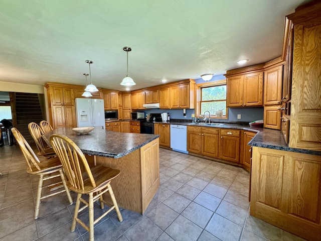 55715 State Highway 11, Warroad, MN 56763 - kitchen with white dishwasher, a sink, dark countertops, stainless steel microwave, and electric range