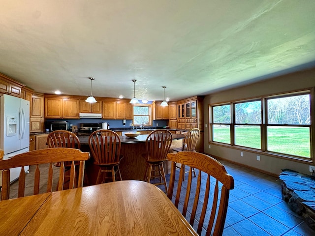 55715 State Highway 11, Warroad, MN 56763 - dining area with light tile patterned floors and baseboards