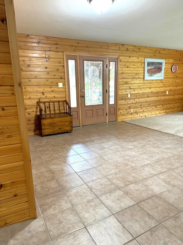 55715 State Highway 11, Warroad, MN 56763 - foyer with wooden walls and light tile patterned floors