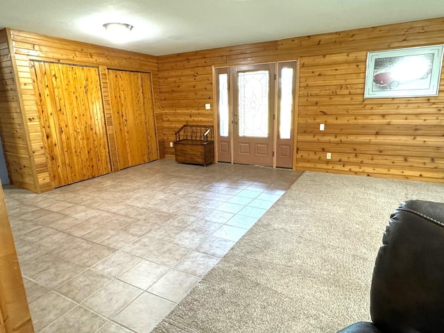 55715 State Highway 11, Warroad, MN 56763 - entryway with wooden walls and light tile patterned floors