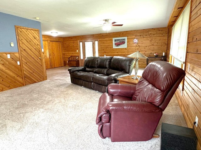 55715 State Highway 11, Warroad, MN 56763 - living room with wooden walls, carpet flooring, and ceiling fan