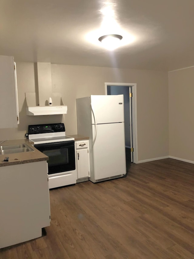 55715 State Highway 11, Warroad, MN 56763 - kitchen with electric range oven, freestanding refrigerator, a sink, dark wood-style floors, and white cabinetry