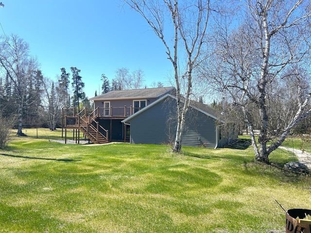 55715 State Highway 11, Warroad, MN 56763 - view of green lawn featuring stairs and a deck