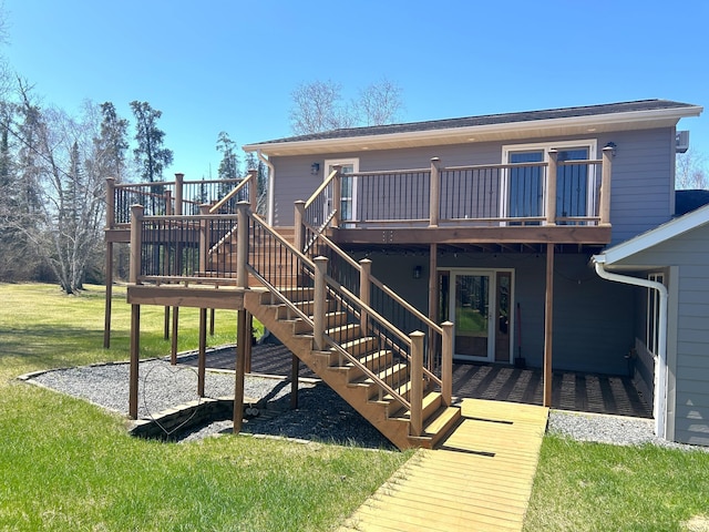 55715 State Highway 11, Warroad, MN 56763 - rear view of house featuring a deck, stairs, and a yard