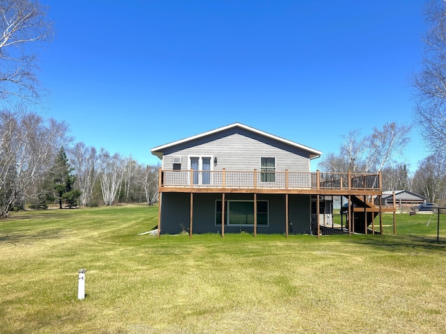 55715 State Highway 11, Warroad, MN 56763 - rear view of house featuring a wooden deck, a yard, and stairway