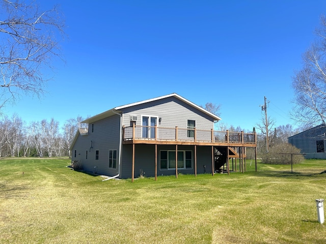 55715 State Highway 11, Warroad, MN 56763 - rear view of house with a wooden deck, stairway, and a lawn