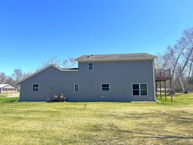 55715 State Highway 11, Warroad, MN 56763 - back of house with a lawn and a deck