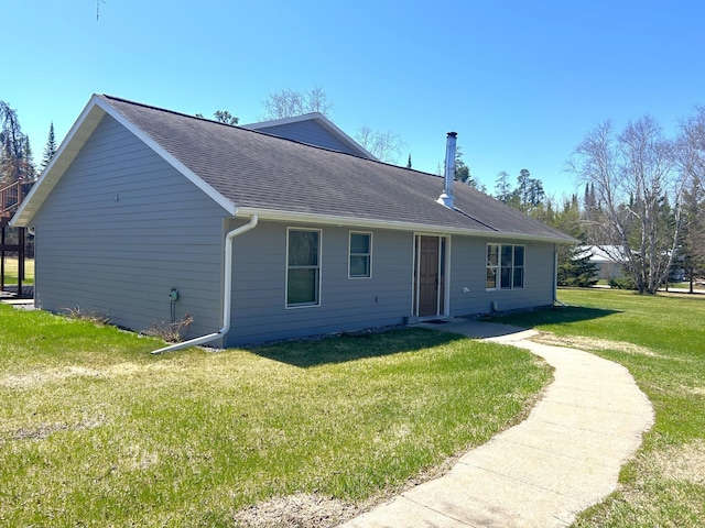 55715 State Highway 11, Warroad, MN 56763 - rear view of house with a yard and a shingled roof