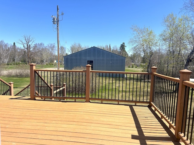 55715 State Highway 11, Warroad, MN 56763 - wooden deck featuring an outbuilding