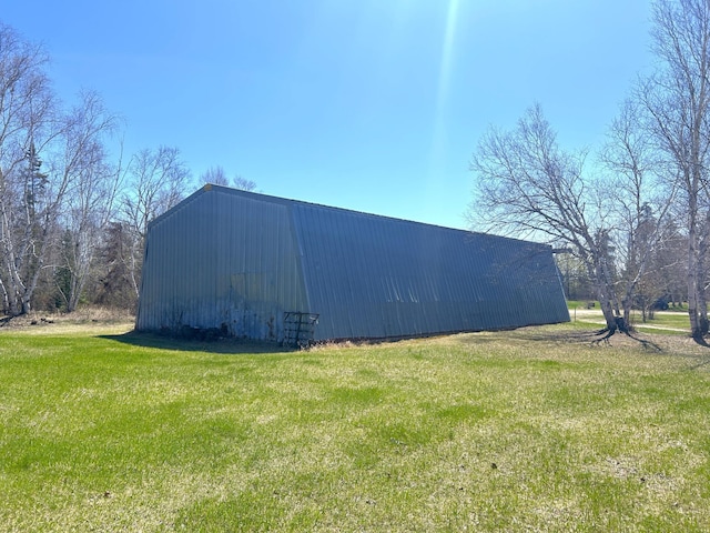 55715 State Highway 11, Warroad, MN 56763 - view of pole building featuring a lawn