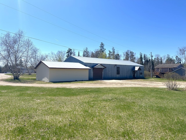 55715 State Highway 11, Warroad, MN 56763 - view of pole building featuring a yard and dirt driveway