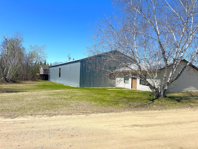 55715 State Highway 11, Warroad, MN 56763 - view of side of property featuring a lawn and an outdoor structure