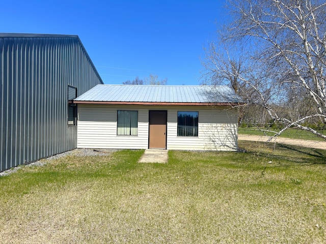 55715 State Highway 11, Warroad, MN 56763 - rear view of house with a lawn and metal roof