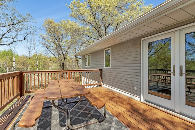 wooden terrace featuring outdoor dining space