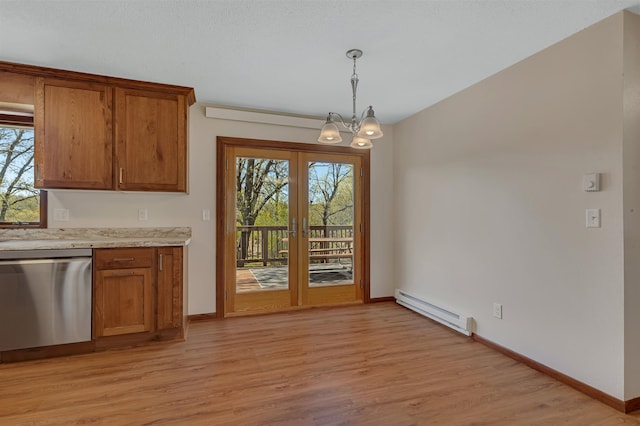 unfurnished dining area featuring baseboard heating, a chandelier, light wood-style flooring, french doors, and baseboards