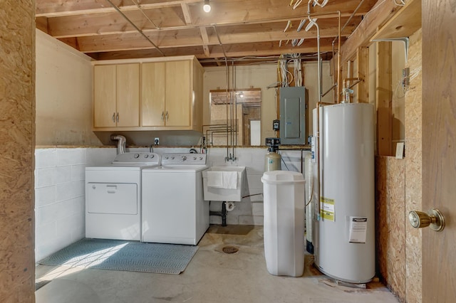 laundry area with water heater, washing machine and clothes dryer, electric panel, and cabinet space